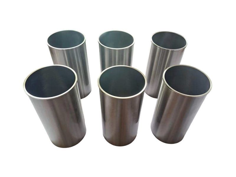 Six engine cylinder liners showing their bores and outer surfaces