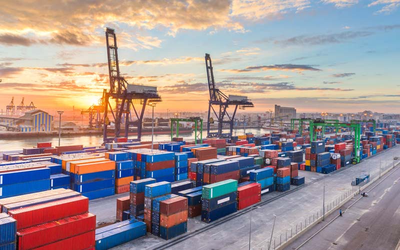Shipping containers and cargo cranes at a seaport