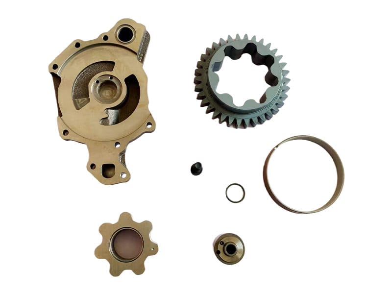 Engine oil pump housing with separate pump components and sealing rings