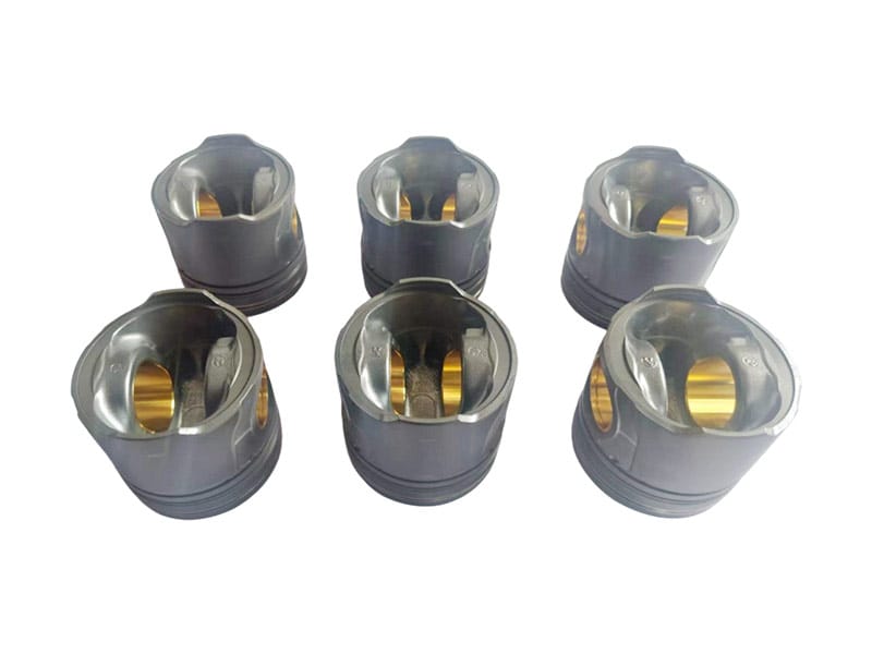 Six engine pistons showing the skirts and pin bores