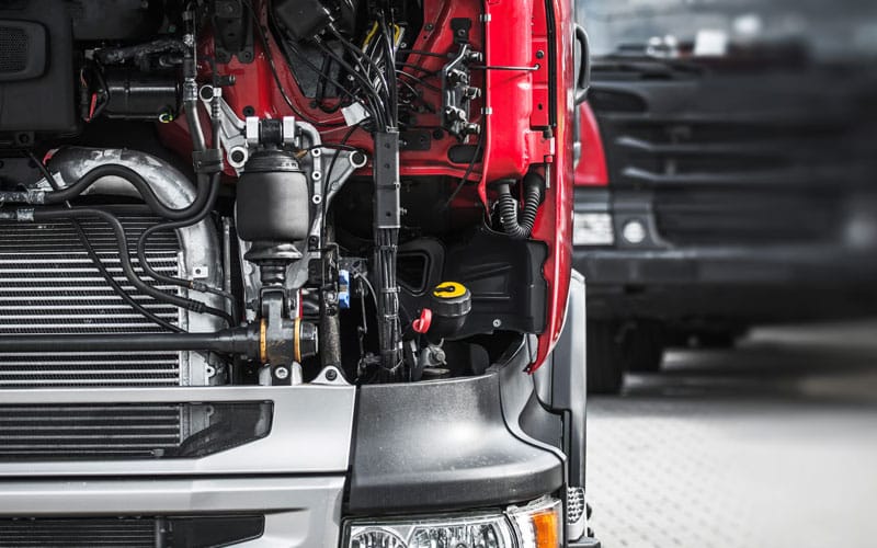 Heavy-duty truck with its engine compartment exposed